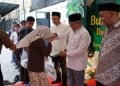Asisten I Sekda Aceh Besar Bersama Bank Aceh Syariah Jantho Serahkan Santunan Anak Yatim